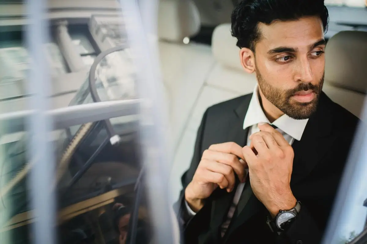 Business traveler using airport limo service